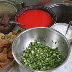 Ta foo is a bright red sauce made from tomatoes and fermented soy